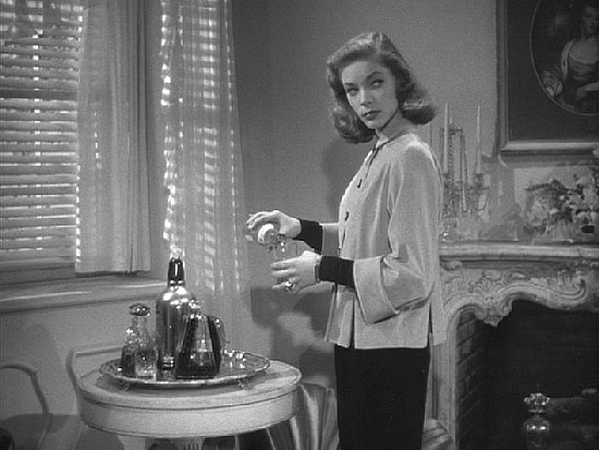 "I sat down...and looked at Mrs. Regan. She was worth a stare. She was trouble." Lauren Bacall as Vivian