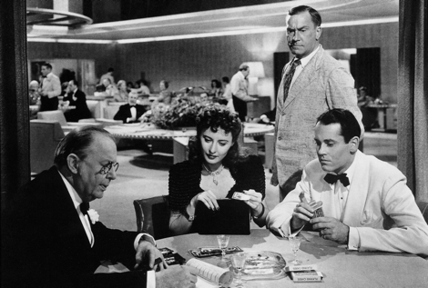 Charles Coburn and Stanwyck work their magic on Henry Fonda under William Demarest's watchful eye  in THE LADY EVE