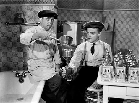 Frank McHugh and James Cagney bottle a little fun in THE ROARING TWENTIES (1939).