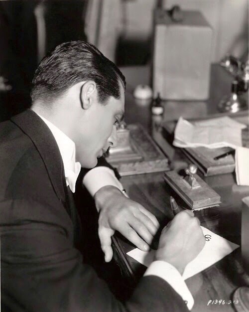 Cary Grant writing a letter